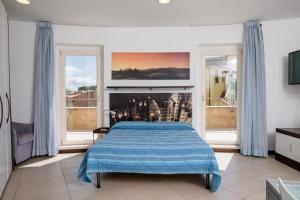 Posteľ alebo postele v izbe v ubytovaní Porta Pispini Residence