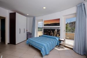 Posteľ alebo postele v izbe v ubytovaní Porta Pispini Residence