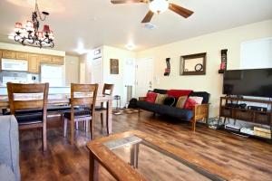 a living room with a table and a couch at Guadalupe Getaway in New Braunfels
