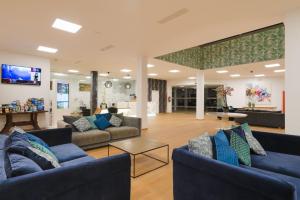 Telewizja i/lub zestaw kina domowego w obiekcie Apartamentos Santa Rosa