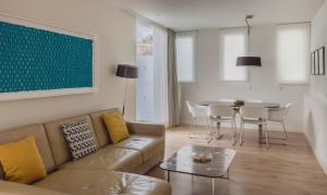 a living room with a couch and a table at Flamingo Beach Mate in Adeje