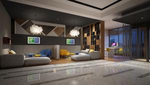 a living room with couches and chairs at Holiday Inn Express Chengdu Jinniu, an IHG Hotel in Chengdu