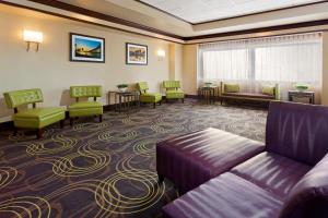 a large waiting room with a couch and chairs at Holiday Inn Clark - Newark, an IHG Hotel in Clark