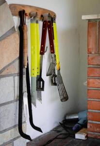a group of tools hanging on a wall at Renaissance Holidays Villa in Nea Kalikratia