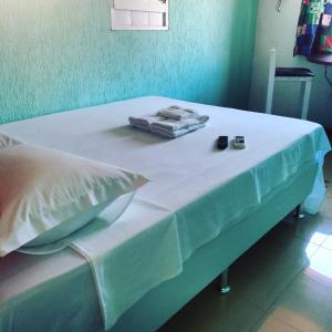 Ένα ή περισσότερα κρεβάτια σε δωμάτιο στο SunriseBelaVista Pousada e Flats