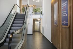 a hallway with an escalator in a building at Holiday Inn Express Baden-Baden, an IHG Hotel in Baden-Baden