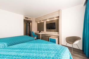 Una cama o camas en una habitación de Hotel Casa Blanca