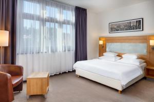 Postel nebo postele na pokoji v ubytování Hermitage Hotel Prague