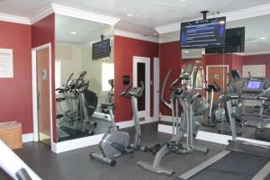 a gym with several tread machines in a room at Holiday Inn Express Corning, an IHG Hotel in Corning