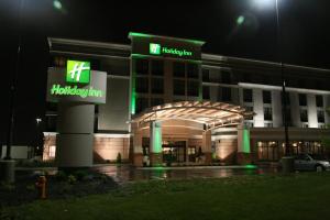 a hospital building at night with green lights at Holiday Inn Columbus-Hilliard, an IHG Hotel in New Rome