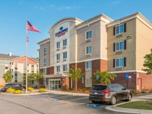 a hotel with a car parked in a parking lot at Candlewood Suites Atlanta West I-20, an IHG Hotel in Lithia Springs