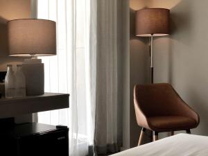 Postel nebo postele na pokoji v ubytování Doowall Hotel