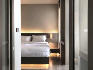 Postel nebo postele na pokoji v ubytování Doowall Hotel