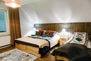 Un pat sau paturi într-o cameră la Dom Panorama