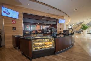 a bakery counter with pastries in a store at Naples Grande Beach Resort in Naples