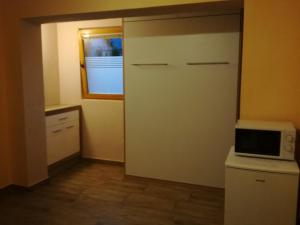 Kuchyň nebo kuchyňský kout v ubytování Apartma Marjetica II.