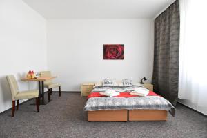 Postel nebo postele na pokoji v ubytování Penzion B5 + 37 fotografií