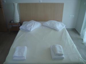 A bed or beds in a room at Meganisi Blue Villa