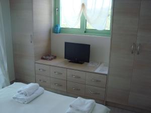A bed or beds in a room at Meganisi Blue Villa