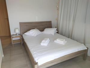 A bed or beds in a room at Meganisi Blue Villa