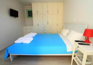 A bed or beds in a room at Meganisi Blue Villa