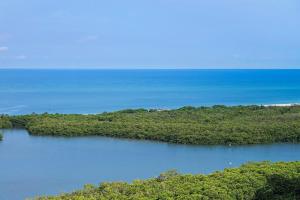 an island in the middle of a body of water at Naples Grande Beach Resort in Naples