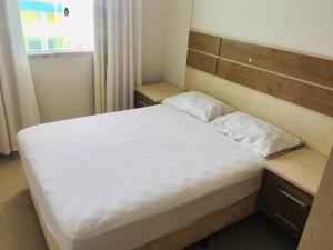 מיטה או מיטות בחדר ב-Apartamentos Mediterrâneo Home Club
