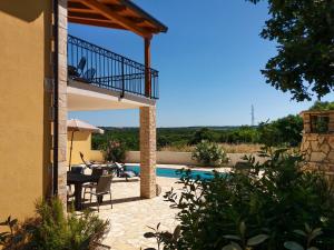 a view of a villa with a swimming pool at Villa Jomi in Tar
