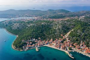 an aerial view of a town on a island in the water at Apartment Milka with sea view in Tisno