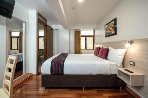 Cama ou camas em um quarto em Casa Matara Boutique