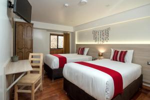 Cama ou camas em um quarto em Casa Matara Boutique