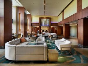 a lobby of a hotel with couches and chairs at Battery Wharf Hotel, Boston Waterfront in Boston