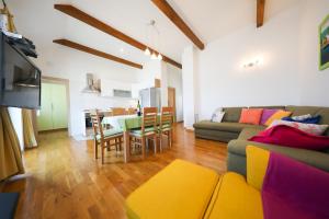 a living room with a couch and a table at Apartment Milka with sea view in Tisno
