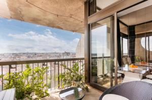 an apartment balcony with a view of the city at Loft Triangle comedie, Parking free in Montpellier