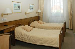 Posteľ alebo postele v izbe v ubytovaní Hotel Restaurant Modrá Hvězda