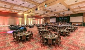 a large banquet hall with tables and chairs at Sky Ute Casino Resort in Ignacio +59 photos