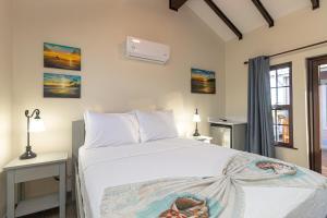 Кровать или кровати в номере Casa Nova Cabanas