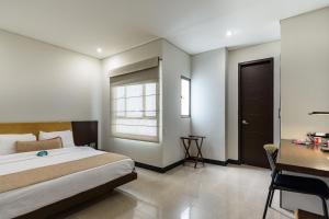 Postel nebo postele na pokoji v ubytování Hotel Lincoln