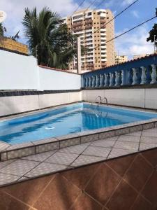 Photo de la galerie de l'établissement Casa Guilhermina com Piscina e Churrasqueira, à Praia Grande