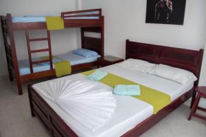 Letto o letti in una camera di Hotel Joohn Gay only LGBTIQ