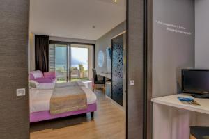 Posteľ alebo postele v izbe v ubytovaní Hotel La Fiorita