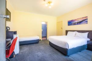 Postel nebo postele na pokoji v ubytování Links Hotel