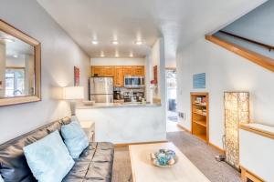 a living room with a couch and a table at Beaches Inn | Sand Dune Townhouse in Cannon Beach