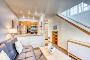 a living room with a couch and a table at Beaches Inn | Orca Bay Townhouse in Cannon Beach