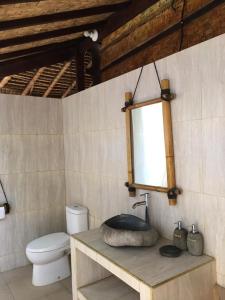 a bathroom with a sink and a toilet at Good Karma Bungalows in Amed +35 photos