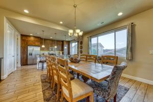 a kitchen and dining room with a wooden table and chairs at Redstone Villa: Paradise Village #47 in Santa Clara
