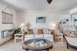 a living room with a couch and a table at Ocean Place in Ocean City