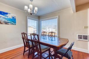 a dining room with a table and four chairs at Dolphin 1 in Rockaway Beach