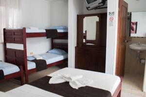 Letto o letti in una camera di Hotel Joohn Gay only LGBTIQ