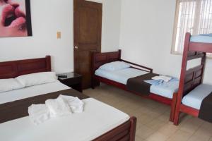 Letto o letti in una camera di Hotel Joohn Gay only LGBTIQ